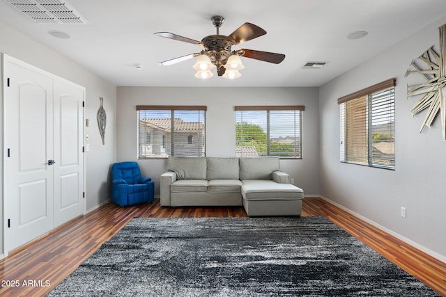 4960 E Colonial Dr, Chandler, AZ 85249 - living room featuring ceiling fan, wood finished floors, and baseboards