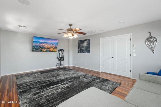 4960 E Colonial Dr, Chandler, AZ 85249 - living area featuring ceiling fan, wood finished floors, and baseboards
