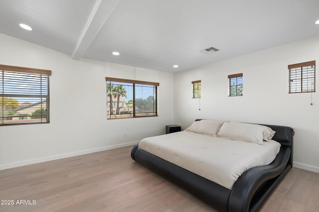 4960 E Colonial Dr, Chandler, AZ 85249 - bedroom with multiple windows, light wood-style floors, baseboards, recessed lighting, and beam ceiling