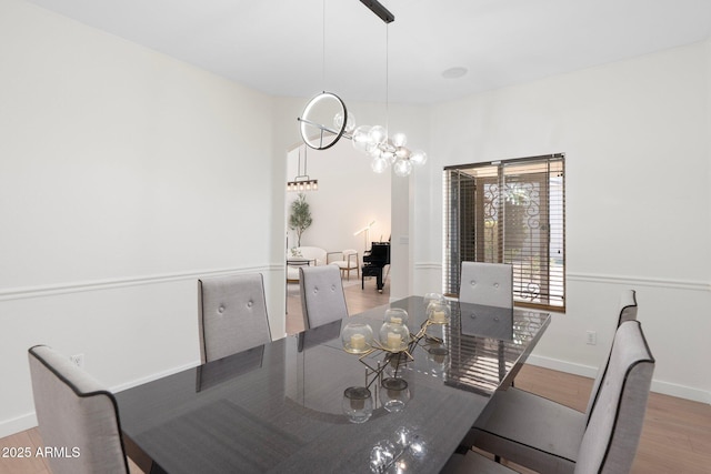 4960 E Colonial Dr, Chandler, AZ 85249 - dining room with wood finished floors, baseboards, and a chandelier