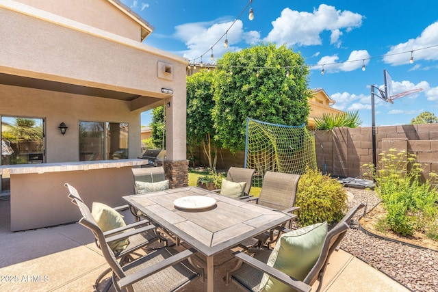 4960 E Colonial Dr, Chandler, AZ 85249 - fenced backyard with outdoor dining space and a patio area