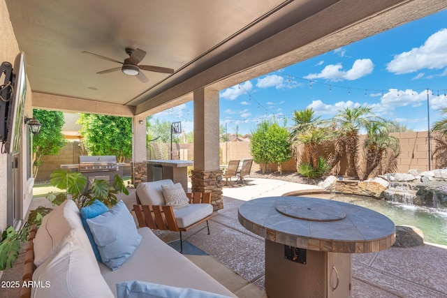 4960 E Colonial Dr, Chandler, AZ 85249 - fenced backyard with an outdoor kitchen, an outdoor living space, ceiling fan, and a patio