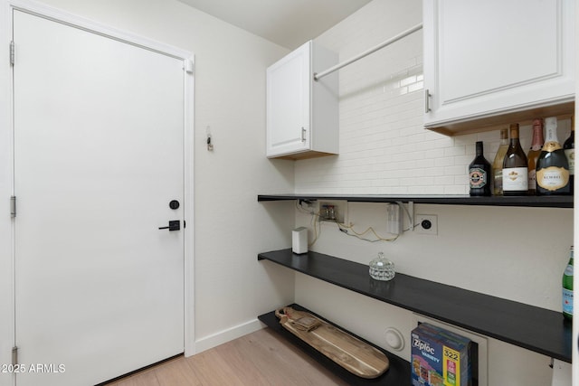 4960 E Colonial Dr, Chandler, AZ 85249 - laundry area featuring cabinet space, hookup for an electric dryer, light wood-style floors, and baseboards