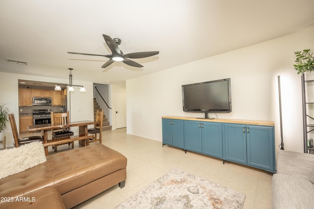 29110 N 24th Ln, Phoenix, AZ 85085 - living area with stairway and ceiling fan