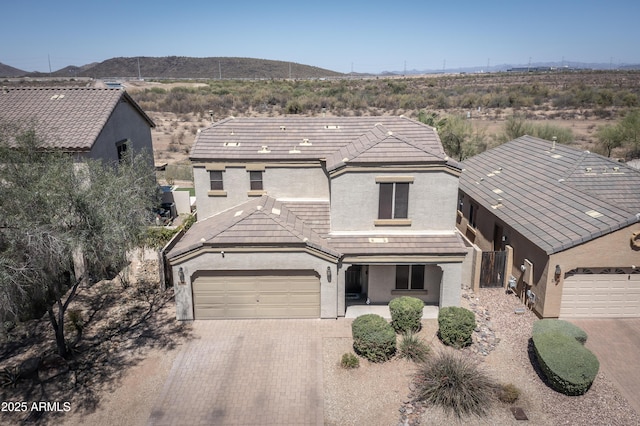 29110 N 24th Ln, Phoenix, AZ 85085 - view of front facade featuring stucco siding, an attached garage, driveway, and a mountain view