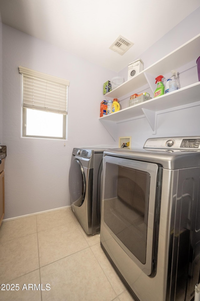 29110 N 24th Ln, Phoenix, AZ 85085 - washroom featuring washer and dryer, light tile patterned floors, and baseboards