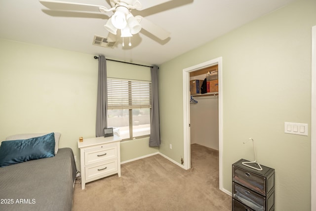 29110 N 24th Ln, Phoenix, AZ 85085 - bedroom with light carpet, a walk in closet, ceiling fan, baseboards, and a closet