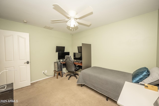 29110 N 24th Ln, Phoenix, AZ 85085 - bedroom featuring light colored carpet, an office area, a ceiling fan, and baseboards