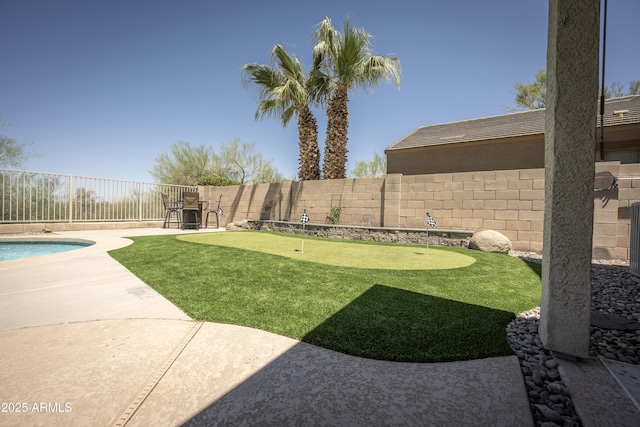 29110 N 24th Ln, Phoenix, AZ 85085 - fenced backyard featuring a putting area and a patio