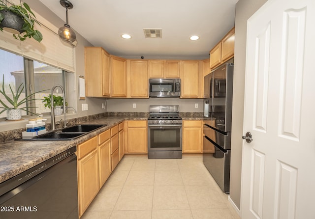 29110 N 24th Ln, Phoenix, AZ 85085 - kitchen featuring appliances with stainless steel finishes, light brown cabinetry, light tile patterned floors, dark countertops, and recessed lighting