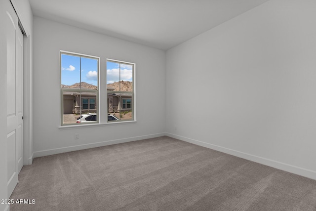 21541 W Mariposa St, Buckeye, AZ 85396 - carpeted spare room with baseboards