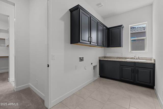 21541 W Mariposa St, Buckeye, AZ 85396 - clothes washing area with cabinet space, washer hookup, hookup for an electric dryer, and baseboards