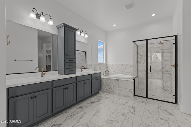 21541 W Mariposa St, Buckeye, AZ 85396 - full bath featuring a bath, a shower stall, marble finish floors, double vanity, and recessed lighting