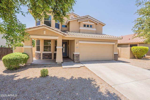 view of front facade with driveway, stone siding, a tiled roof, fence, and stucco siding