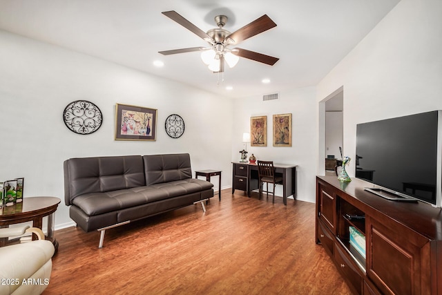 living room with recessed lighting, wood finished floors, visible vents, baseboards, and a ceiling fan