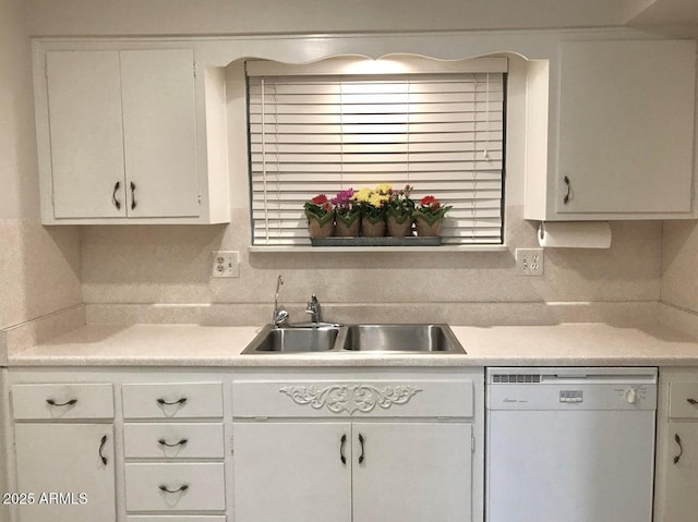 kitchen with decorative backsplash, dishwasher, white cabinets, and sink