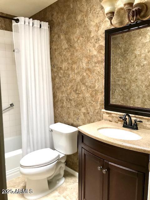 full bathroom featuring shower / tub combo, vanity, and toilet