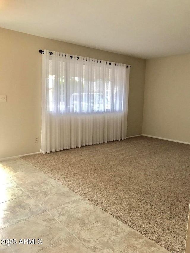 unfurnished room with carpet