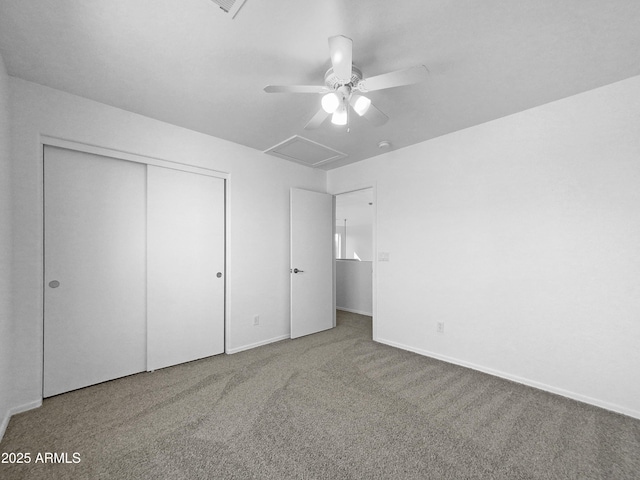 unfurnished bedroom with a closet, ceiling fan, and carpet floors