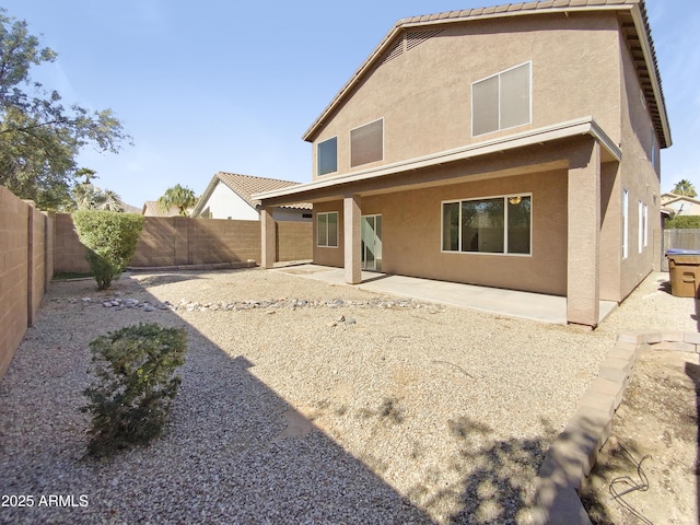 rear view of house featuring a patio area