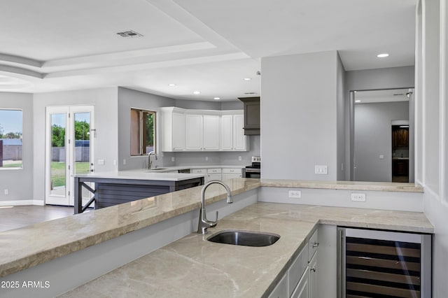24615 S 182nd Pl, Gilbert, AZ 85298 - kitchen featuring wine cooler, stainless steel electric range, recessed lighting, light stone counters, and white cabinetry