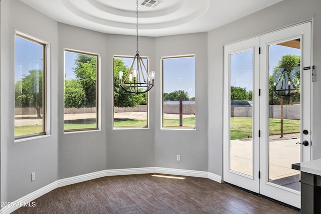 24615 S 182nd Pl, Gilbert, AZ 85298 - unfurnished dining area featuring a chandelier, dark wood-type flooring, and a tray ceiling