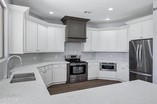 24615 S 182nd Pl, Gilbert, AZ 85298 - kitchen featuring appliances with stainless steel finishes, recessed lighting, premium range hood, dark wood-style floors, and white cabinets