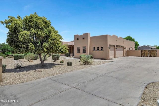 24615 S 182nd Pl, Gilbert, AZ 85298 - pueblo-style house featuring a garage, driveway, and stucco siding