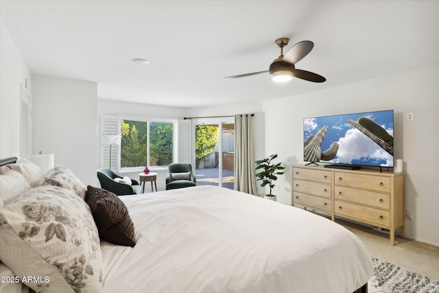 8405 E San Pedro Dr, Scottsdale, AZ 85258 - bedroom featuring access to exterior, light carpet, and a ceiling fan