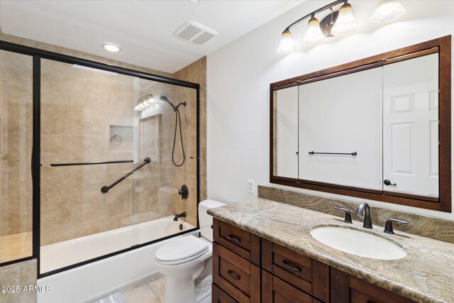 8405 E San Pedro Dr, Scottsdale, AZ 85258 - full bathroom featuring vanity, bath / shower combo with glass door, and toilet