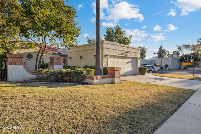 8405 E San Pedro Dr, Scottsdale, AZ 85258 - view of side of property featuring concrete driveway, an attached garage, a lawn, and stucco siding