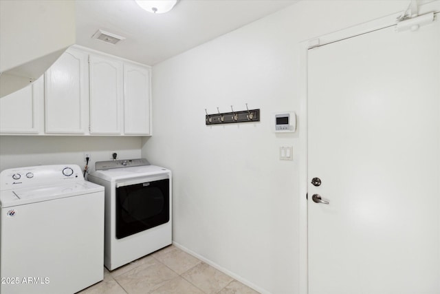 8405 E San Pedro Dr, Scottsdale, AZ 85258 - clothes washing area featuring washing machine and clothes dryer, cabinet space, baseboards, and light tile patterned floors