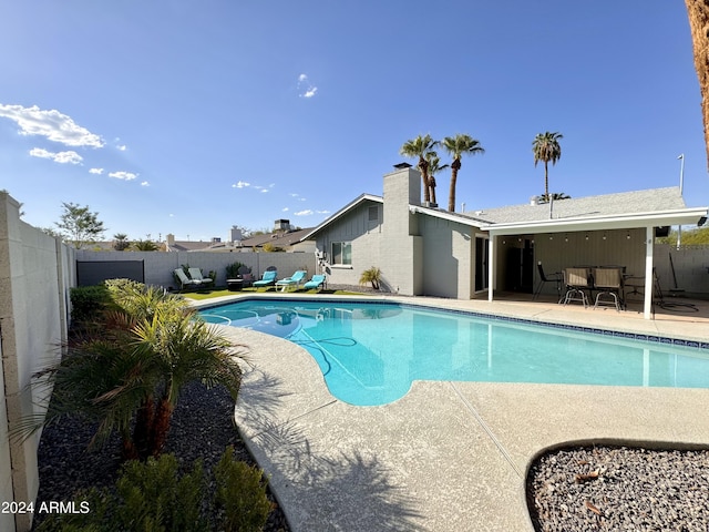 view of swimming pool with a patio