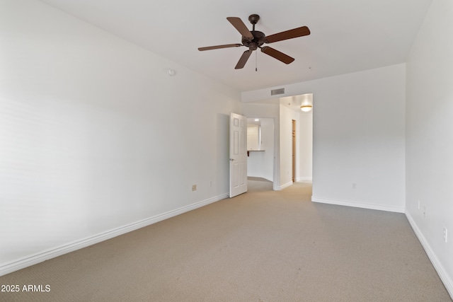 interior space with ceiling fan and light carpet