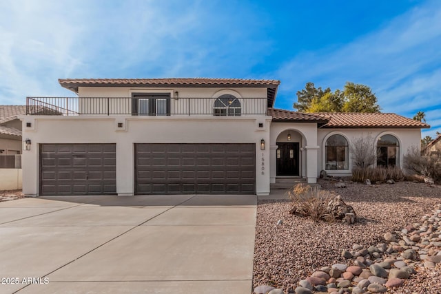 mediterranean / spanish house featuring a garage