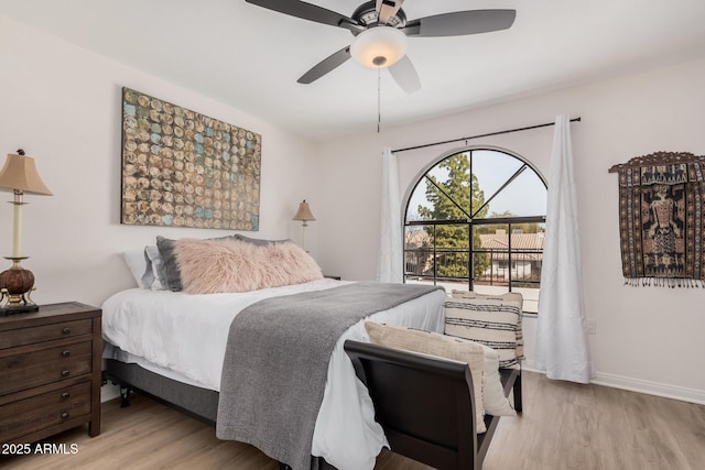 bedroom featuring ceiling fan and light hardwood / wood-style flooring