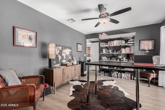 office area with ceiling fan and light hardwood / wood-style flooring