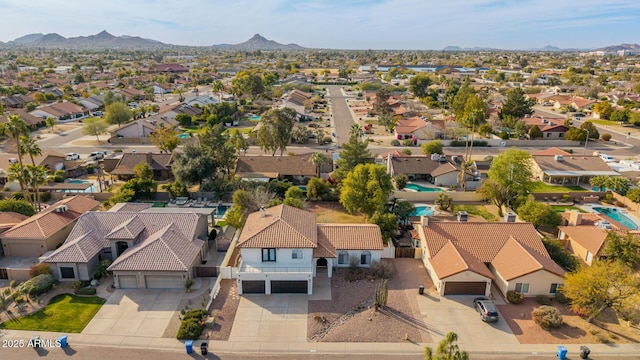 birds eye view of property with a mountain view