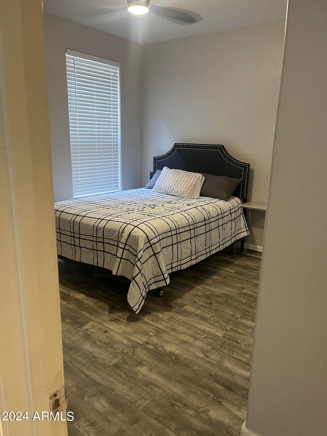 bedroom featuring dark hardwood / wood-style floors and ceiling fan