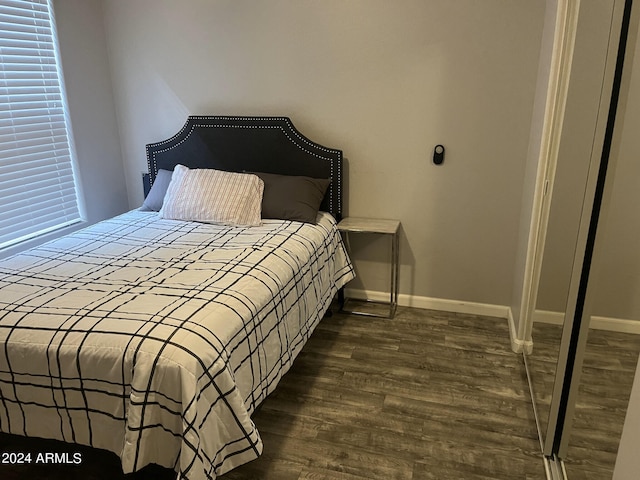 bedroom featuring dark hardwood / wood-style flooring