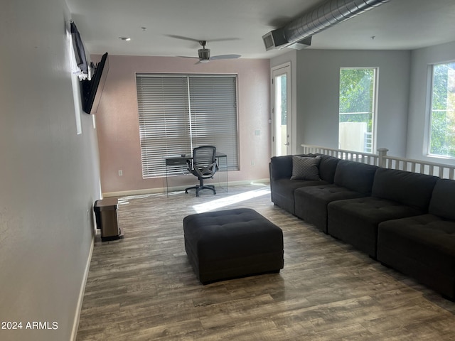 living room with hardwood / wood-style floors and ceiling fan