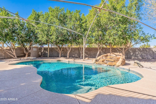 view of pool featuring a fenced backyard, a fenced in pool, and a patio