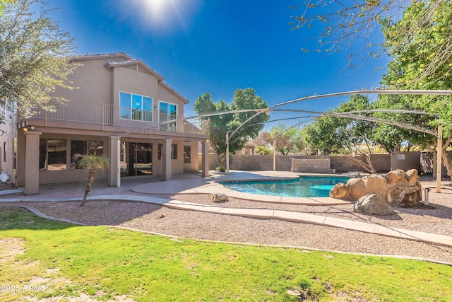 view of swimming pool with a patio area, fence, and a fenced in pool