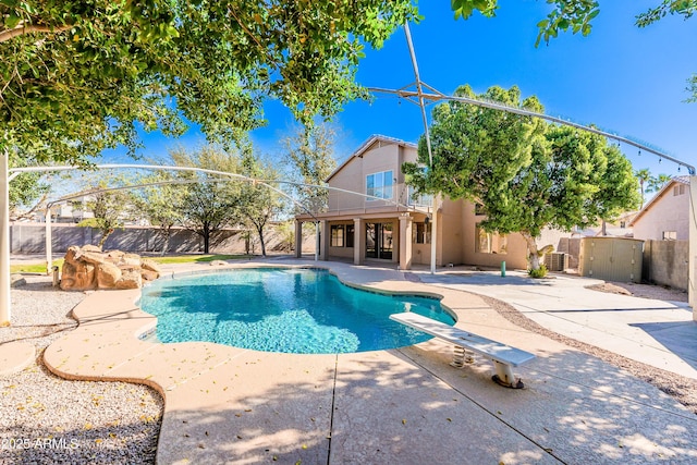 view of swimming pool with a patio area, a fenced backyard, and a fenced in pool