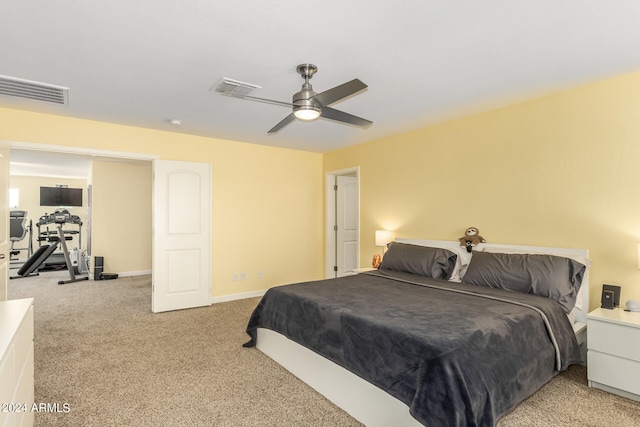 bedroom with ceiling fan and light colored carpet