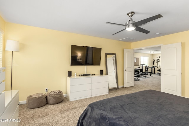 carpeted bedroom featuring ceiling fan