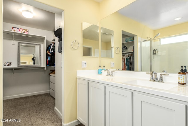 bathroom featuring vanity and an enclosed shower