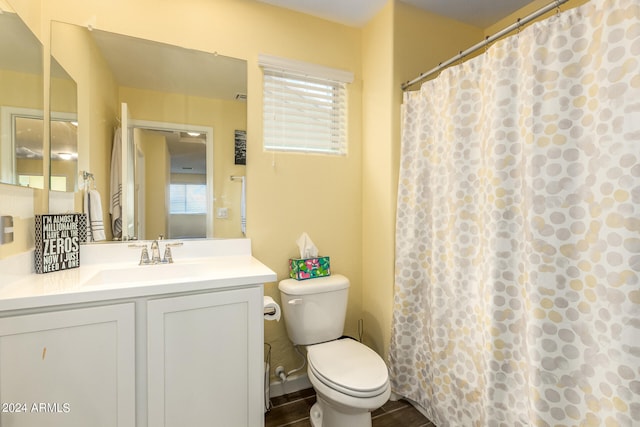 bathroom featuring vanity and toilet