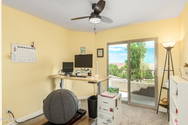 home office featuring ceiling fan and light colored carpet