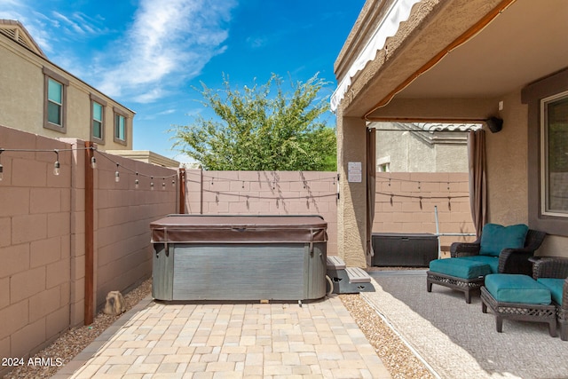 view of patio / terrace featuring a hot tub